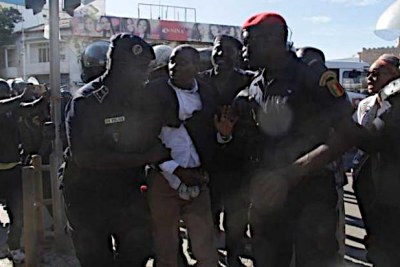 Police dispersing opposition leaders in Senegal who tried to stage a sit-in at a government building.