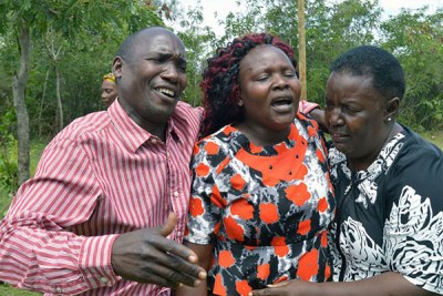 The mother of slain Sharon Otieno, Melida Auma (centre), is comforted by her relatives at their home in Magare village, Homa Bay County (file photo).