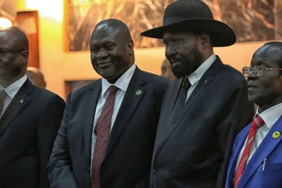 Salva Kiir, President of South Sudan, centre right, with Riek Machar, centre left, who was sworn in as First Vice President of the new Transitional Government of National Unity on 22 February 2020.