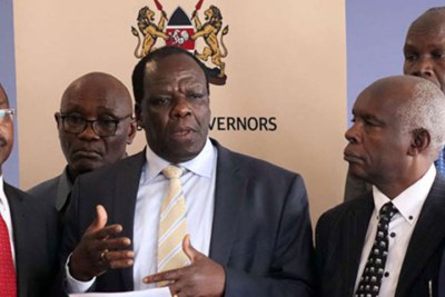 Council of Governors Chairman Wycliffe Oparanya addresses the press in Nairobi, flanked by his colleagues, on August 29.