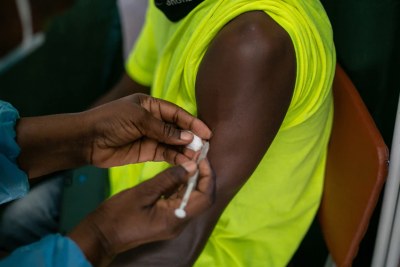 A Zimbabwean receives a Covid-19 vaccine jab at Wilkins Hospital.