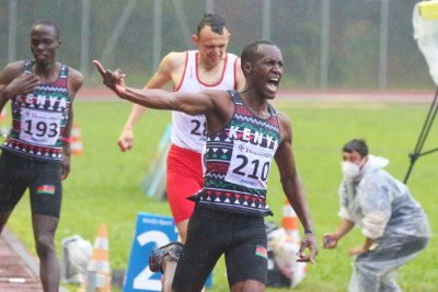 Elkana Rono celebrating after cruising the line in the men's 800m final at Deaflympics, winning gold.
