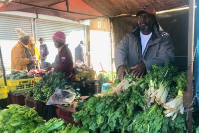 Shepherd Muroyiwa at his veggie stall where he sells produce popular with other Zimbabweans.