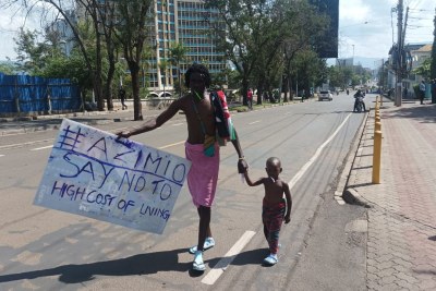 cost of living protester and child (file photo).