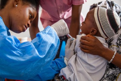 A child receives the new vaccine, R21/Matrix-M, during trials in Kiwangwa, Tanzania.