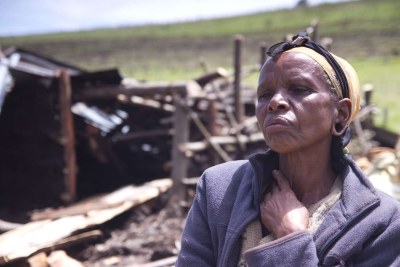 Ogiek woman Elisabeth Tabinoy sits in front of the remains of her torched and smashed home after a previous eviction (file photo).